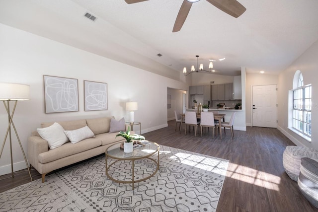 living room with ceiling fan, lofted ceiling, and light hardwood / wood-style floors