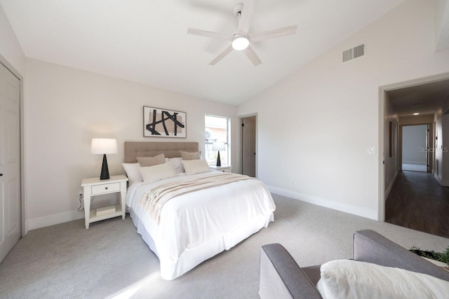 carpeted bedroom featuring high vaulted ceiling and ceiling fan