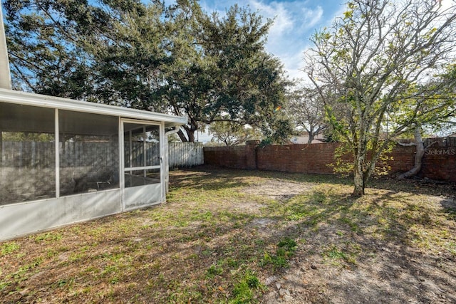 view of yard with a sunroom