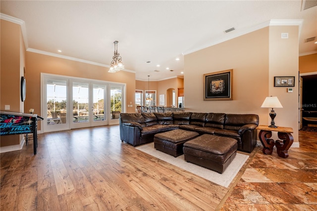 living room with hardwood / wood-style flooring and ornamental molding