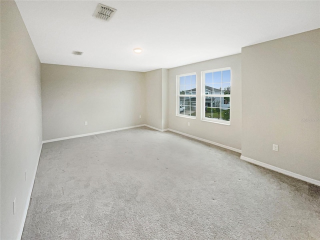 empty room featuring light colored carpet