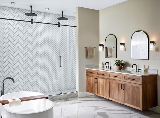 bathroom featuring vanity and shower with separate bathtub