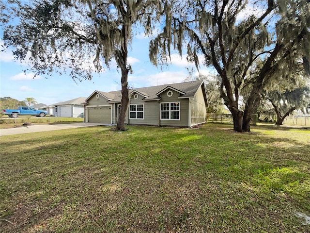 ranch-style home with a garage and a front yard