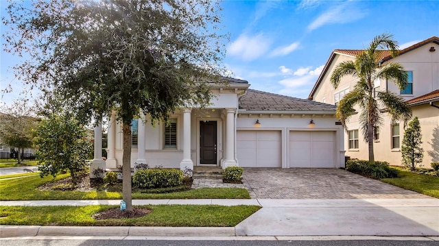 view of front of home with a garage