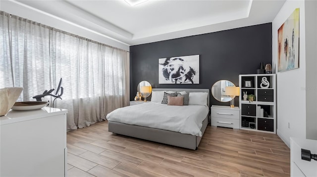 bedroom with a raised ceiling