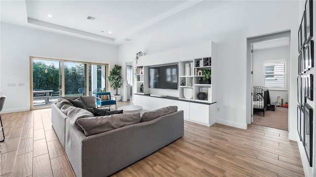 living room featuring a high ceiling