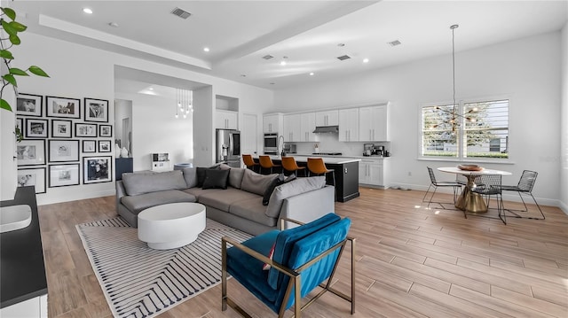 living room featuring a chandelier