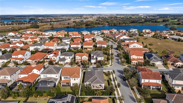 drone / aerial view with a water view