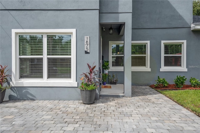 doorway to property with a patio area