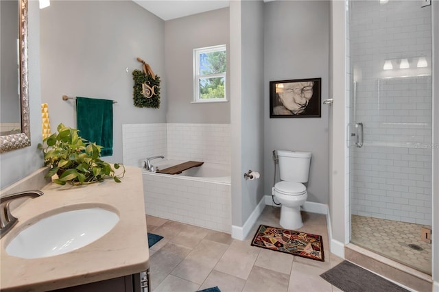 full bathroom featuring toilet, vanity, shower with separate bathtub, and tile patterned flooring