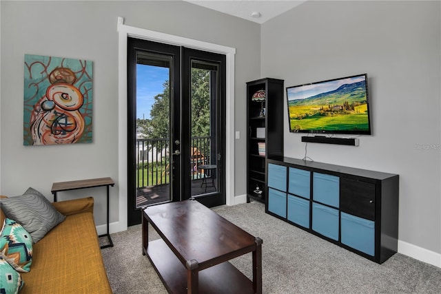 living room featuring light colored carpet and french doors