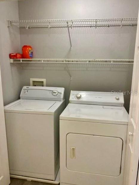 laundry area with washer and clothes dryer