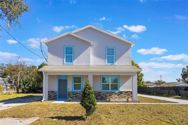 view of front of home featuring a porch and a front lawn