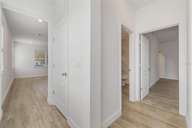 hallway with light wood-type flooring