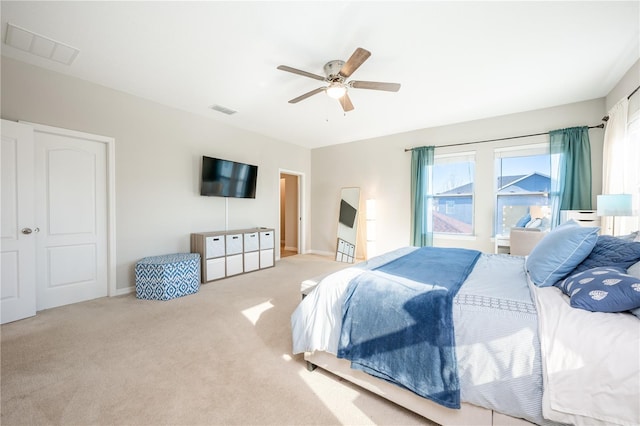 carpeted bedroom featuring ceiling fan