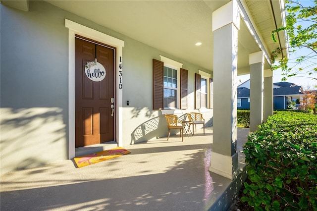 property entrance featuring a porch