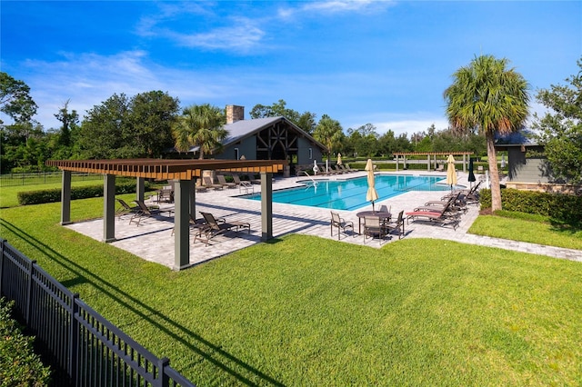 community pool featuring a patio, a yard, fence, and a pergola