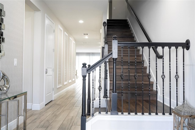 stairs with wood-type flooring