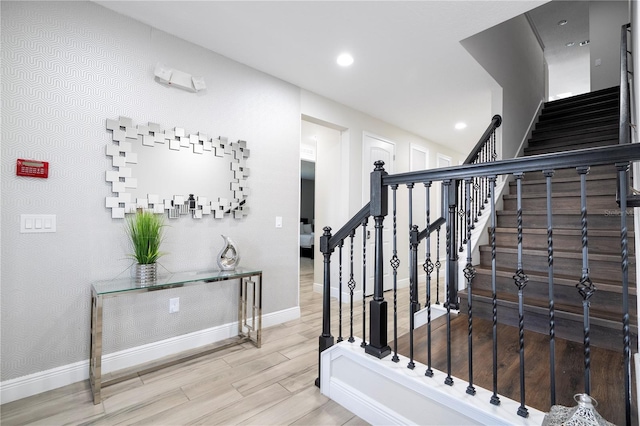 stairs with hardwood / wood-style floors