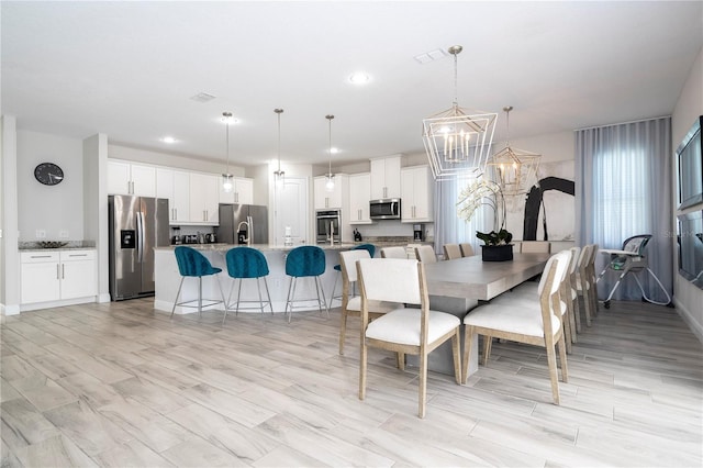 dining space featuring a chandelier