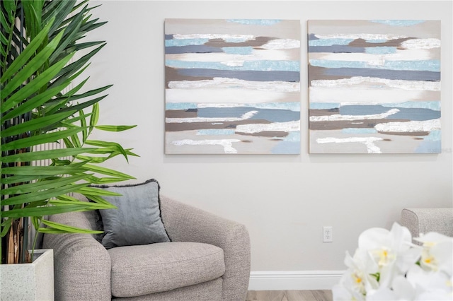 sitting room with hardwood / wood-style flooring