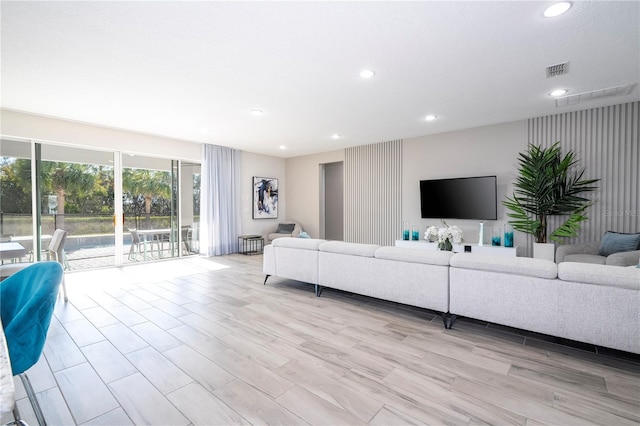 living room with light hardwood / wood-style floors