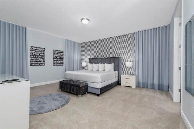 bedroom featuring light carpet