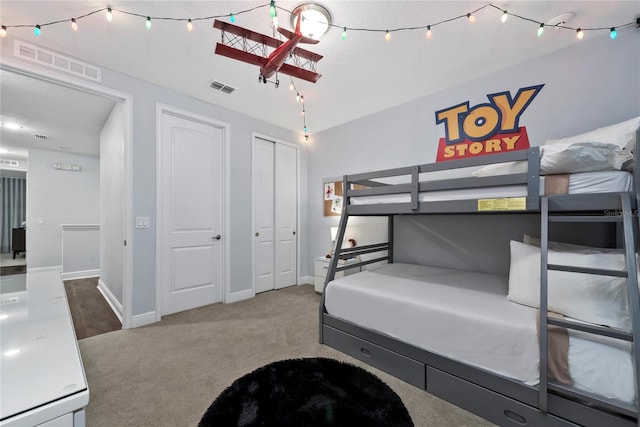 carpeted bedroom featuring a closet