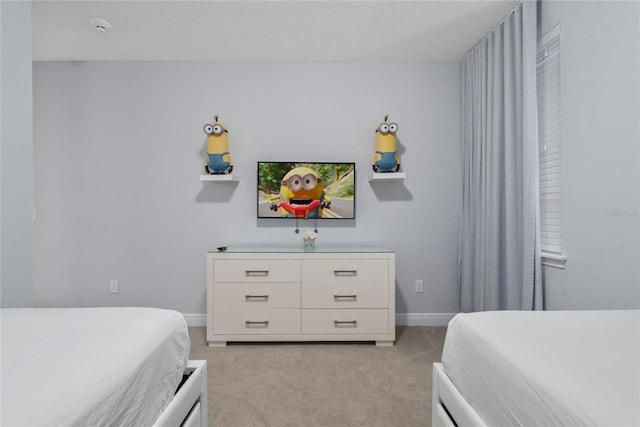 bedroom with light colored carpet