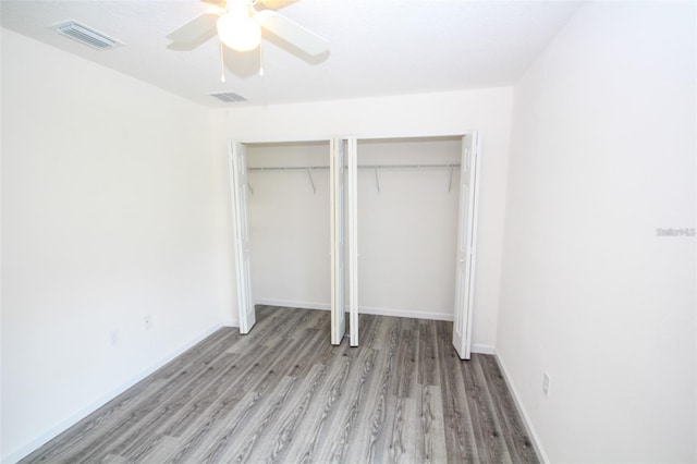 unfurnished bedroom with ceiling fan and light hardwood / wood-style floors