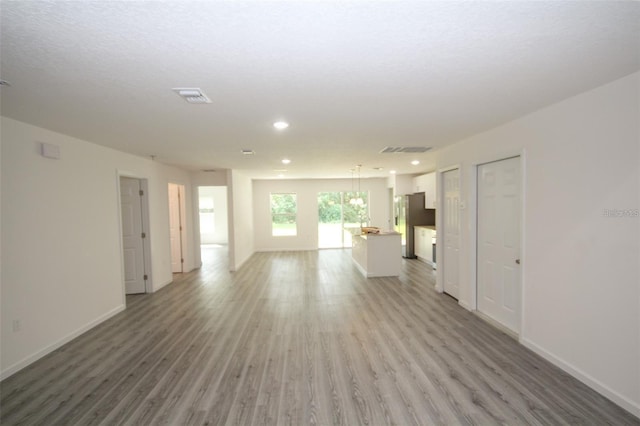 unfurnished living room featuring hardwood / wood-style floors