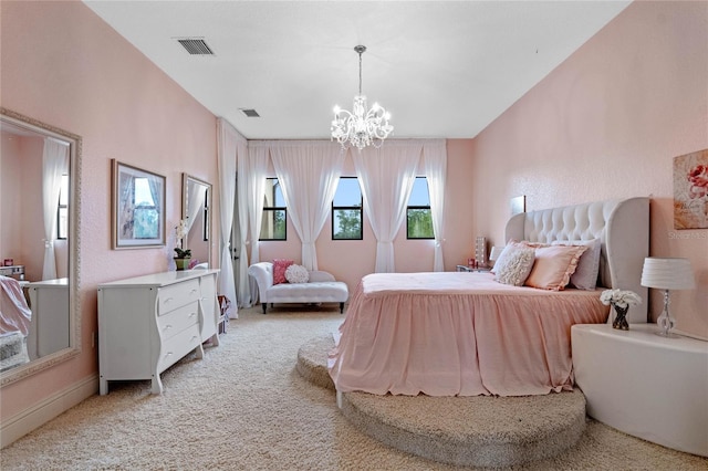 carpeted bedroom with a notable chandelier