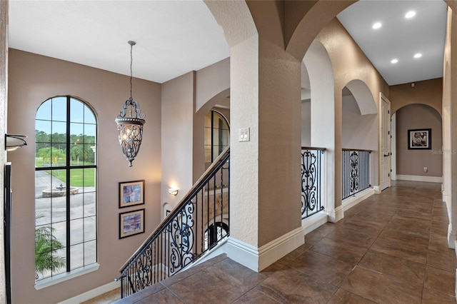 corridor with a chandelier