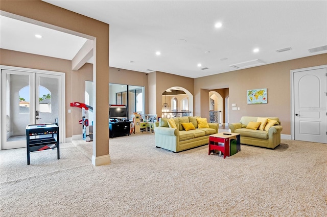 living room with light carpet and french doors