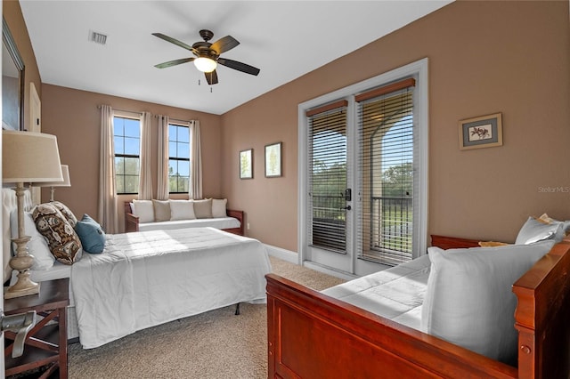 bedroom with ceiling fan, light carpet, and access to outside