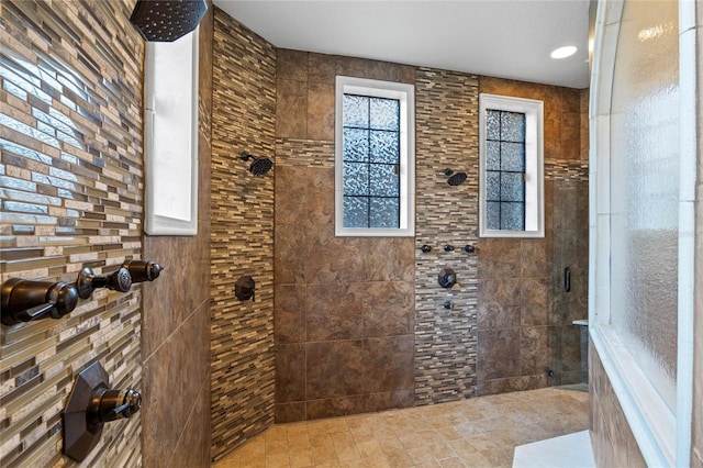 bathroom featuring a tile shower