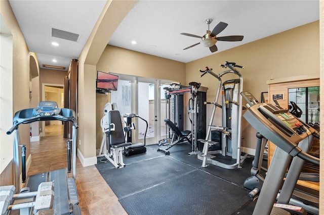 exercise room with ceiling fan