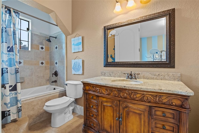 full bathroom featuring vanity, tile patterned floors, shower / bath combination with curtain, and toilet