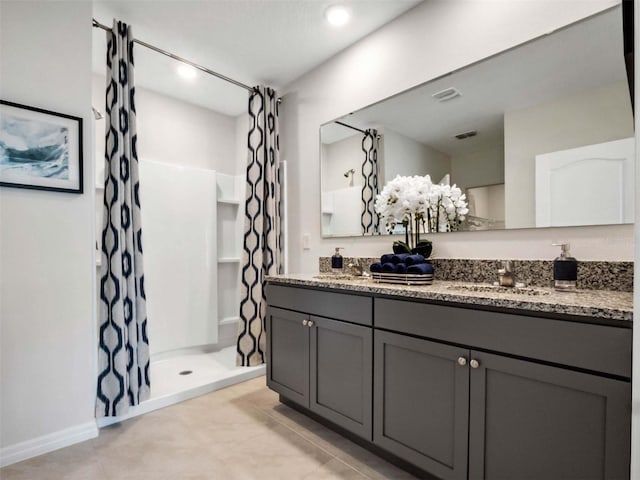 bathroom with vanity, a shower with curtain, and tile patterned floors