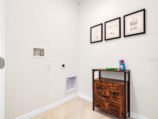 laundry area with light tile patterned flooring, washer hookup, and hookup for an electric dryer