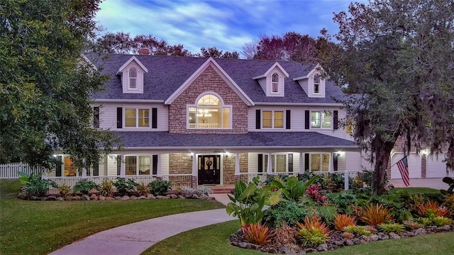 view of front of home with a lawn