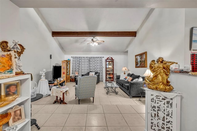 living area with vaulted ceiling with beams, a ceiling fan, and light tile patterned flooring