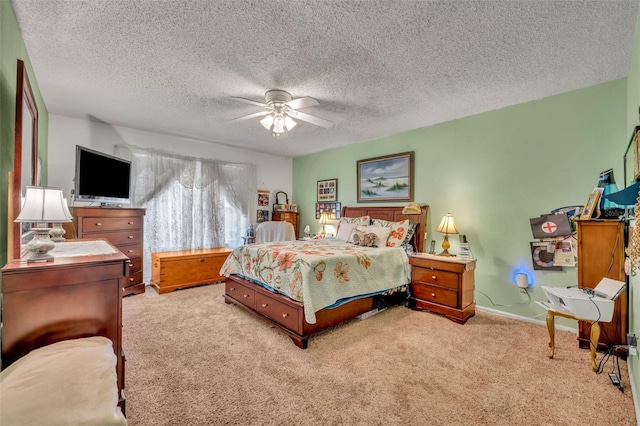 bedroom featuring carpet floors, ceiling fan, a textured ceiling, and baseboards