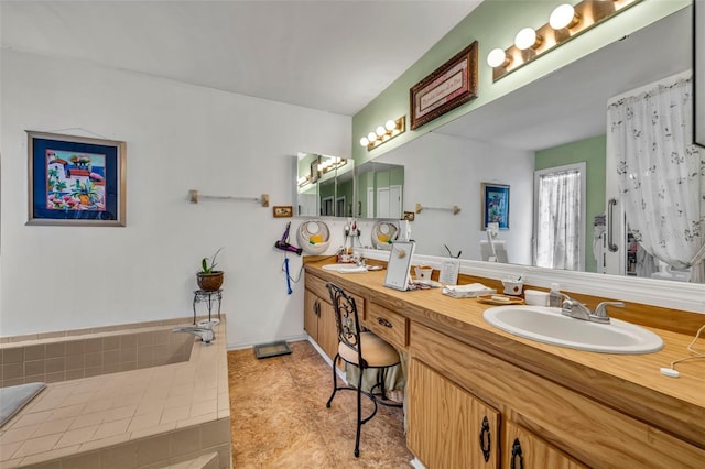 full bathroom with double vanity, baseboards, a sink, and tile patterned floors