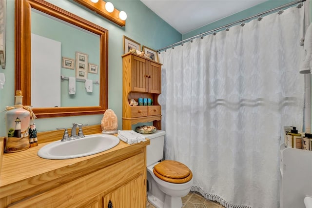 full bathroom featuring a shower with curtain, vanity, toilet, and tile patterned floors