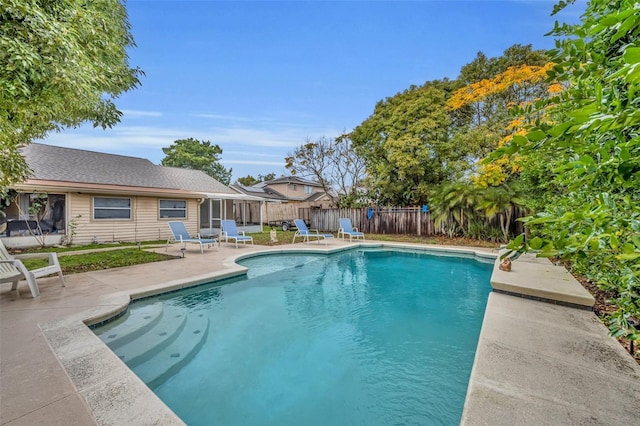 view of swimming pool with a patio area, a fenced backyard, and a fenced in pool