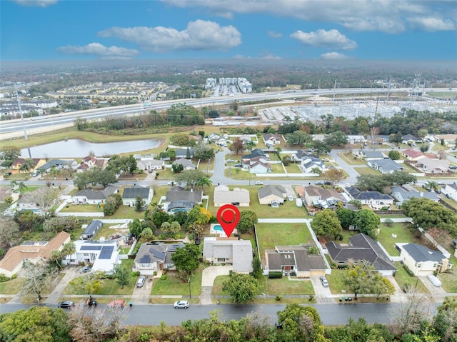 bird's eye view featuring a water view and a residential view