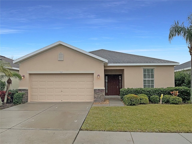 ranch-style house with a garage and a front lawn