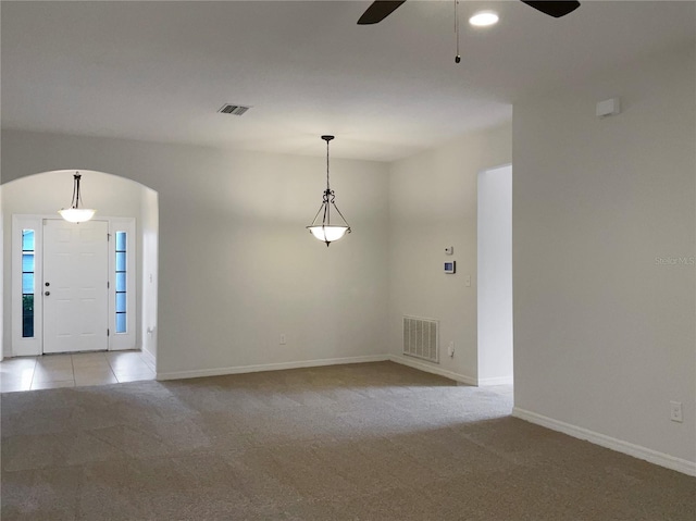 interior space with ceiling fan