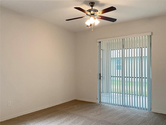 unfurnished room with ceiling fan and carpet floors